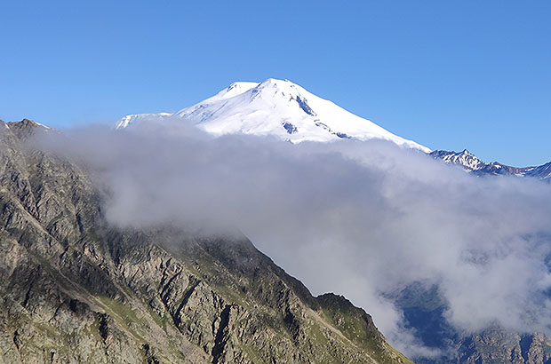 The double-headed Elbrus soars above the clouds.